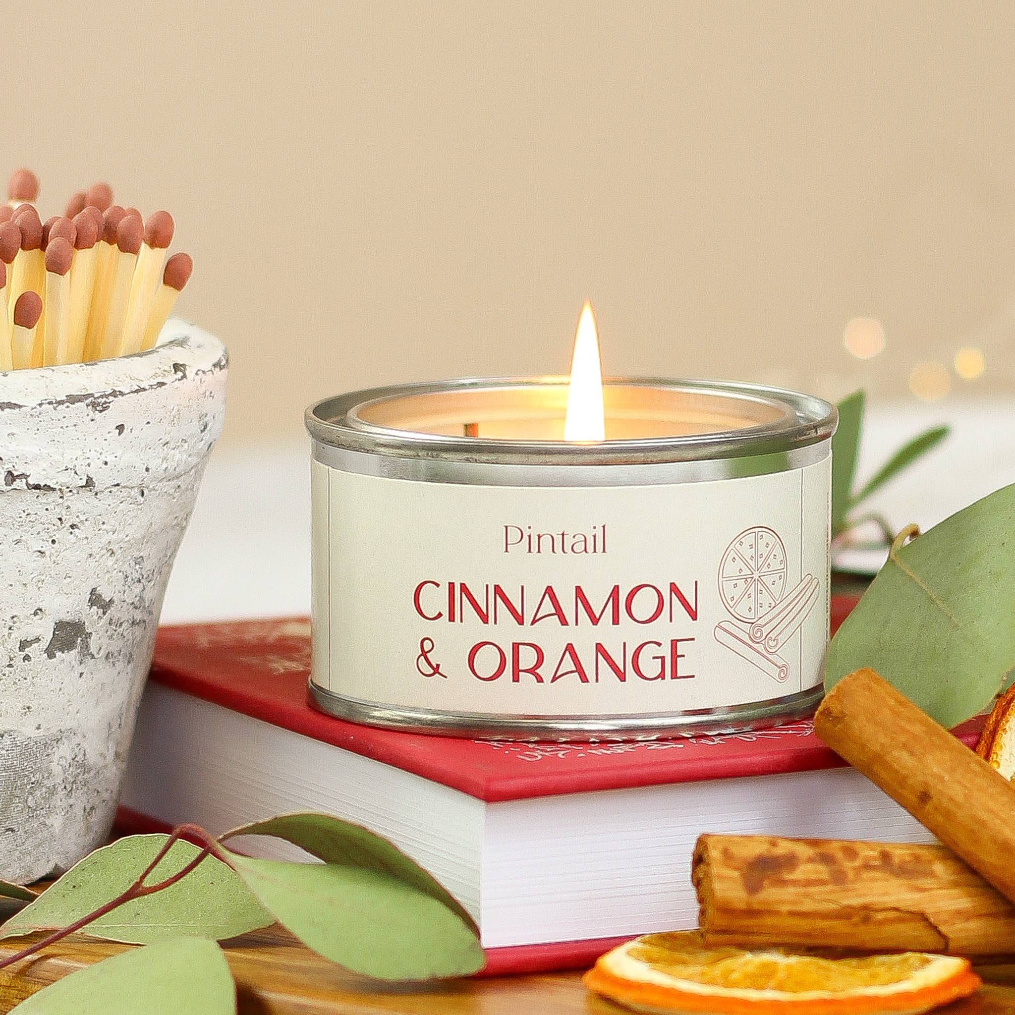 Small candle in paint pot / Christmas cinnamon and orange