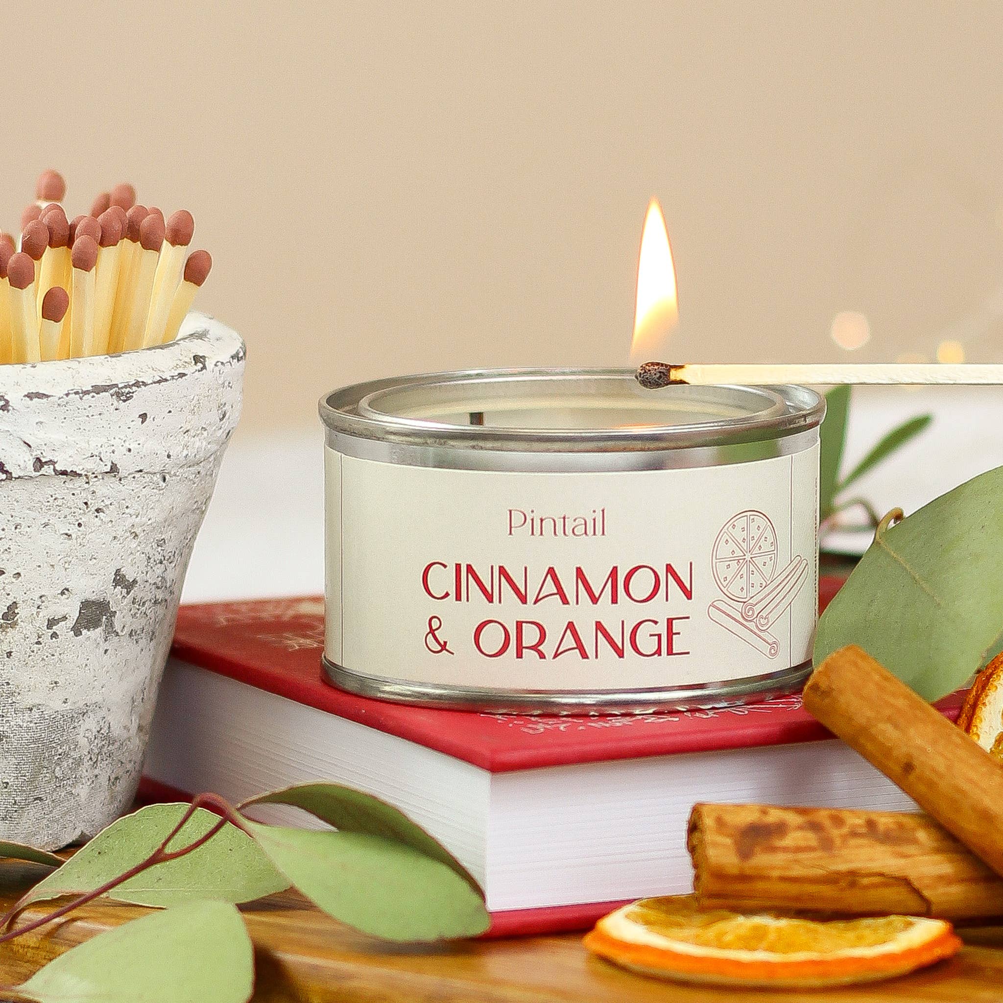 Small candle in paint pot / Christmas cinnamon and orange